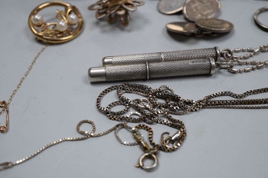 A collection of silver jewels, comprising: a bangle; a chain necklace suspending two winding toothpicks, one with toothpick deficient; a rope twist chain; a pair of cufflinks with the initials DBH; a pendant of abstract